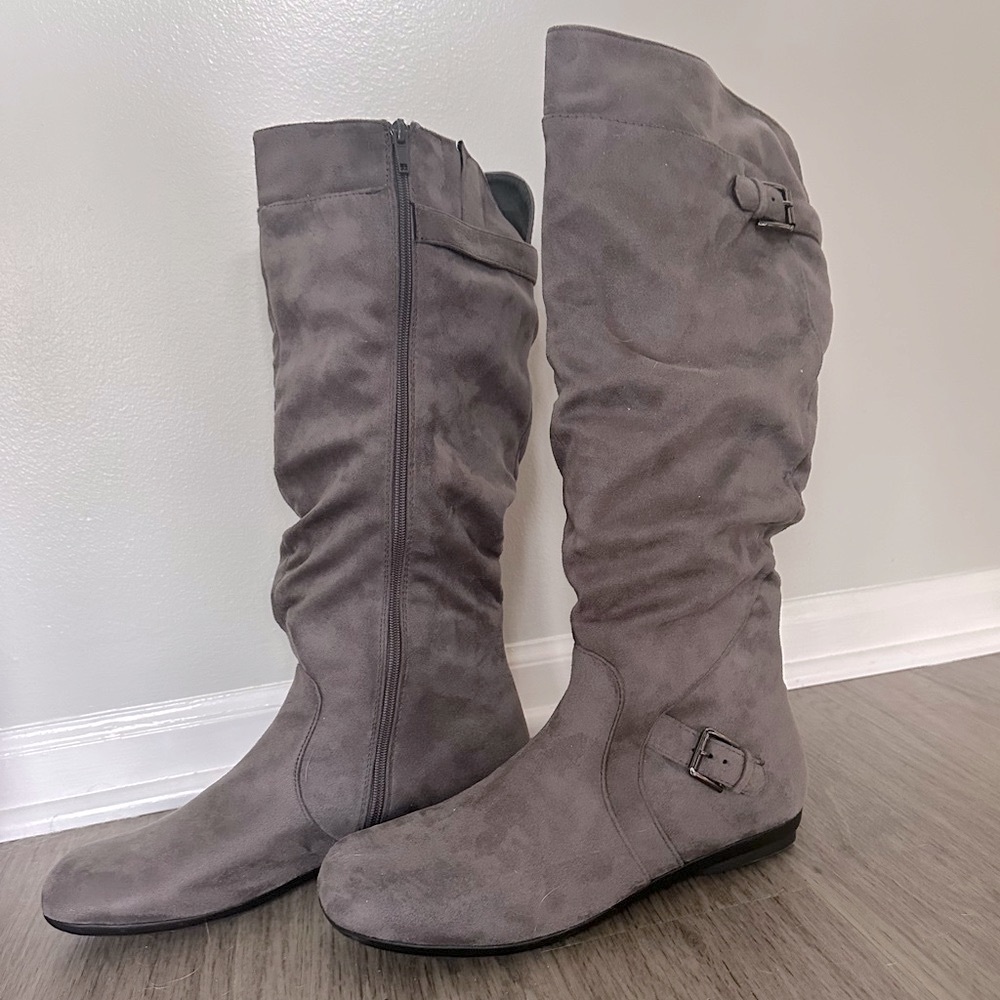 NWOT Gray Faux Suede Zip Up Boots embellished w/ buckles. No heel, round toe.